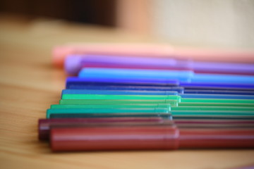 Fototapeta premium close up of colored pens arranged on the table