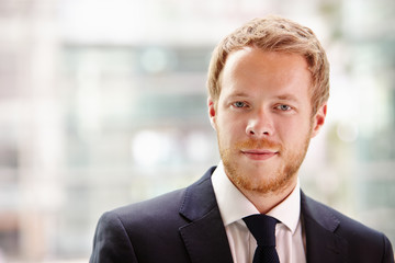 Fototapeta premium Head and shoulders portrait of a young businessman