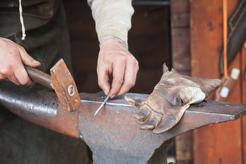 hammer on blacksmith anvil