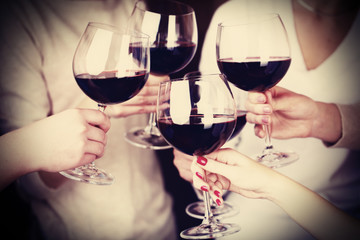 Woman hands with glasses of wine close-up