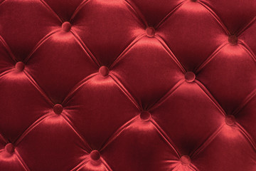 Fototapeta premium red textile upholstery pattern with buttons
