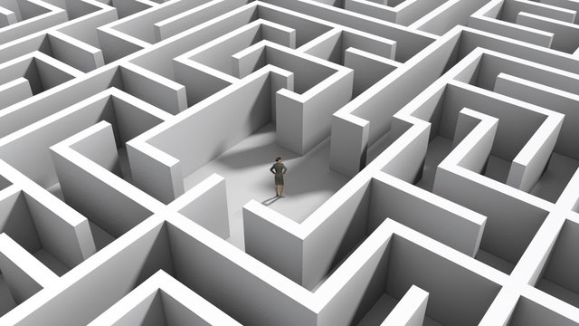 Businesswoman standing in middle of maze
