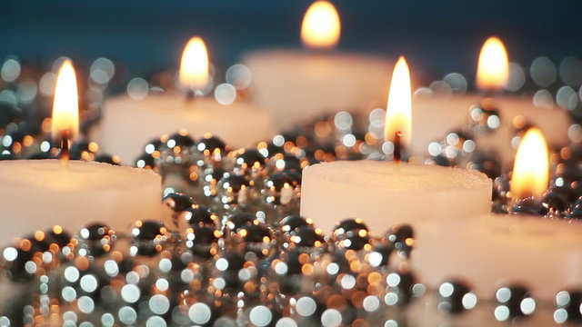 burning candles and christmas beads loopable
