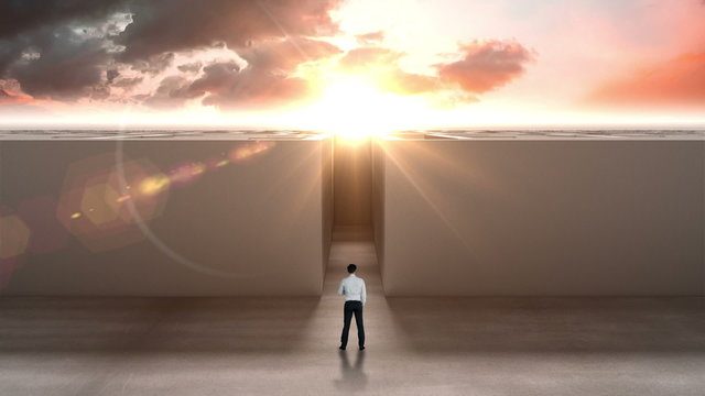 Businessman at entrance of maze