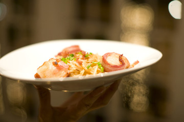 gourmet meal of bacon wrapped scallops and Fettuccine
