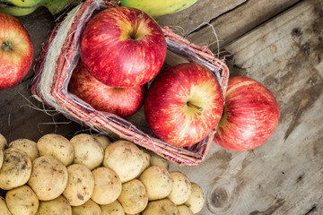 Assorted fresh fruit natural background wood floors.
