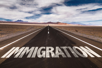 Immigration written on desert road