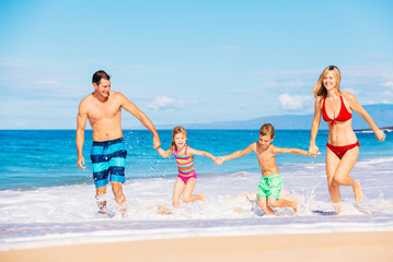 Happy Family Having Fun on the Beach