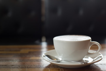 Hot art Latte Coffee in a cup on wooden table