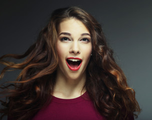 Young happy woman with wind in hair 