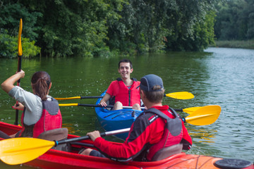 The couple goes kayaking on the river