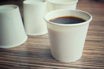 Obraz na płótnie Canvas Coffee in paper cup