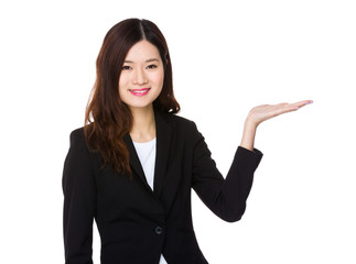 Young businesswoman with hand showing blank sign