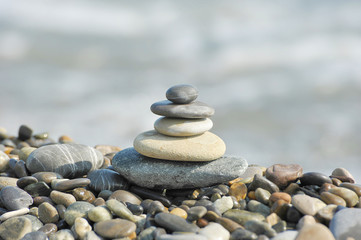 a pyramid of sea stones