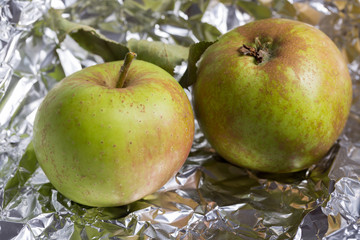 two fresh apples in tinfoil