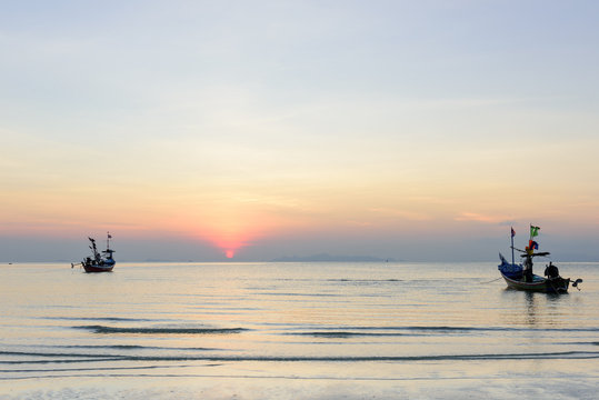 Seascape sunset with longtail bpat floating,Thailand
