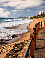 View of Umhlanga Rocks Lighthouse, Milennium Pier and beach from the promenade - obrazy, fototapety, plakaty