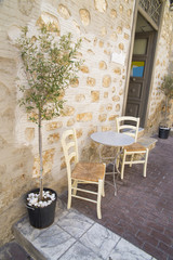 Fototapeta na wymiar table chairs, greek island, Syros