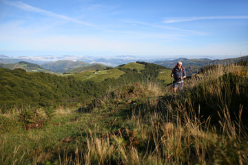 Hiker on a journey in Basque country mountains