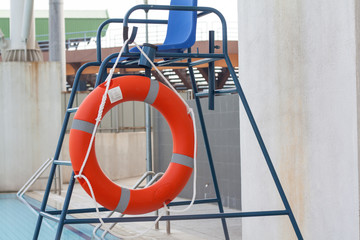 Orange Life Buoy attached to life guard stand