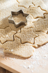 close up of a cookie cutter and a cake dough