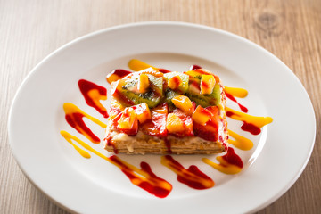 Fruit cake on a wooden table.