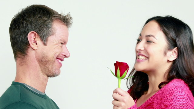 Smiling couple bing romantic together