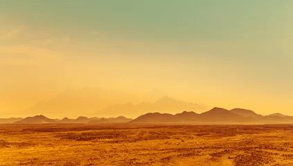 Fototapeten Sonnenaufgang in einer Steinwüste - Berglandschaft in Afrika. © Repina Valeriya