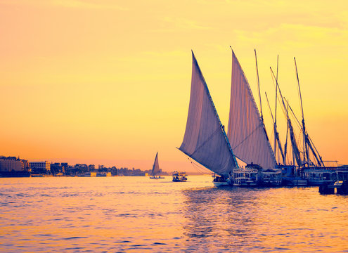 Feluccas at sunset on Nile river in Egypt.