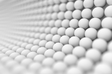 Abstract background displays the white spheres with shallow depth of field.