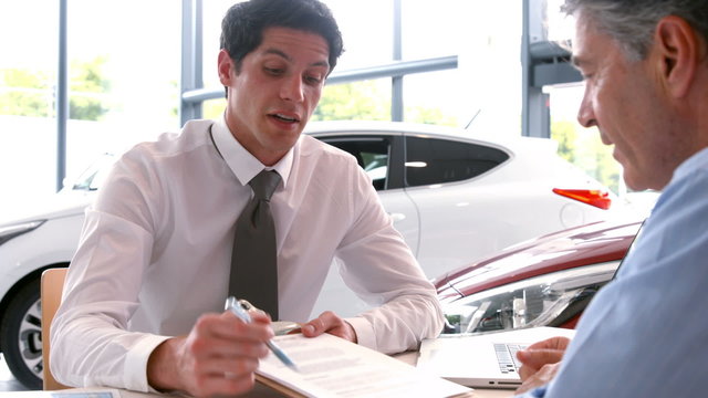 Businessman explaining the car details