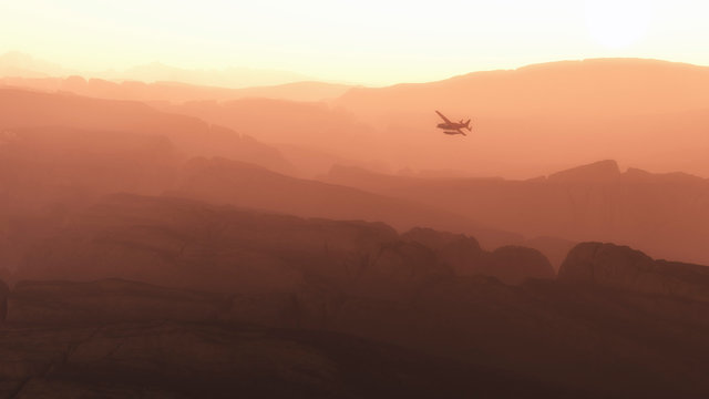 Private airplane flying over mountains in morning mist.