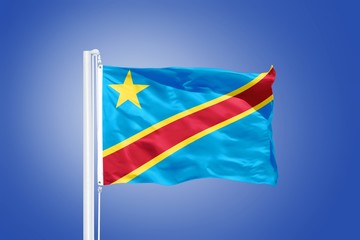 Flag of Congo flying against a blue sky