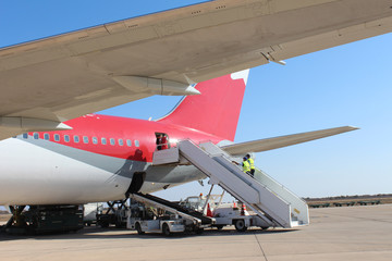 Landing strip. Aircraft preparation to the flight.
