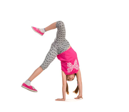 little girl turning handsprings