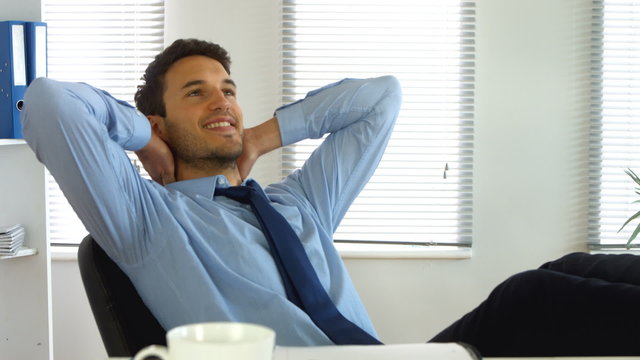 Businessman relaxing while at work