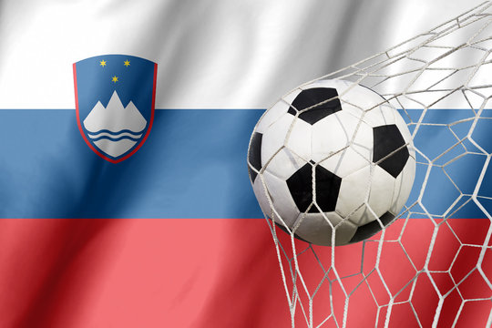 Slovenia flag and soccer ball, football in goal net