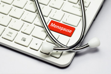 Keyboard, Menopause text and Stethoscope