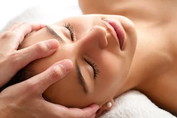 Foto op Canvas Macro relaxing facial massage. © karelnoppe