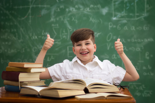 Happiness schoolboy finishing with learning