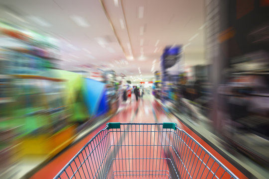 motion blur of supermarket cart in supermarket
