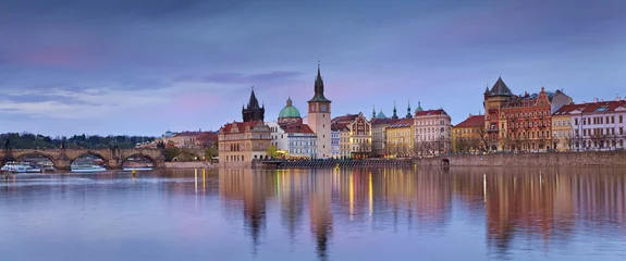 Foto op Canvas Prague Panorama. Panoramic image of Prague riverside and Charles Bridge, with reflection of the city in Vltava River. © rudi1976