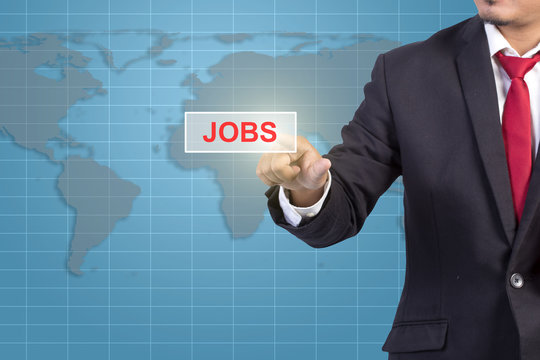 Businessman hand touching JOBS sign on virtual screen - job sear