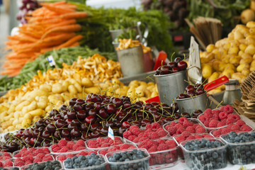 Marketplace with garden truck, vegetables, fruits, berries etc. in Helsinki, Finland