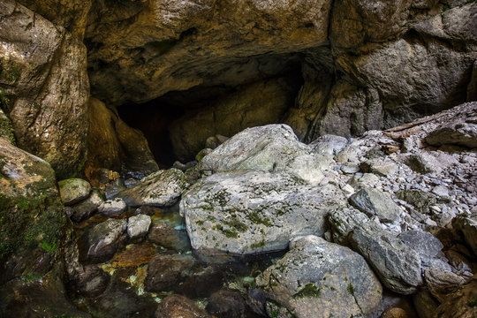 Entrance of a cave with underground river