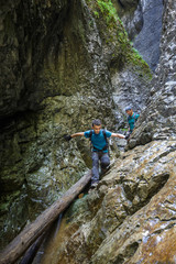 Two men hiker walking in a canyon