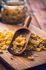 Pile of organic cereal on the wooden cutting board