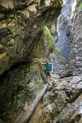 Fototapeta premium Man hiker walking in a canyon