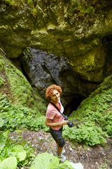 Woman taking pictures of a sinkhole