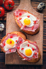Bruschetta with ham and fried eggs 